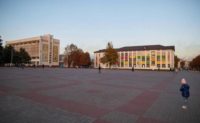 город