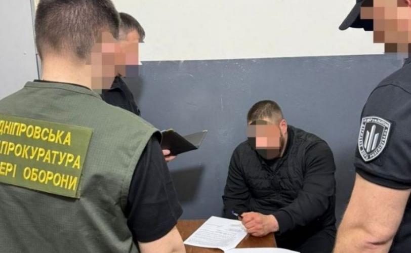 катування